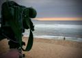 video camera recording beach and sunset